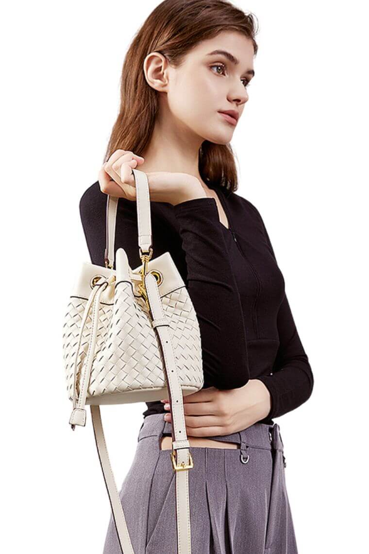 women small crossbody bag with drawstring closure and top handle in woven leather