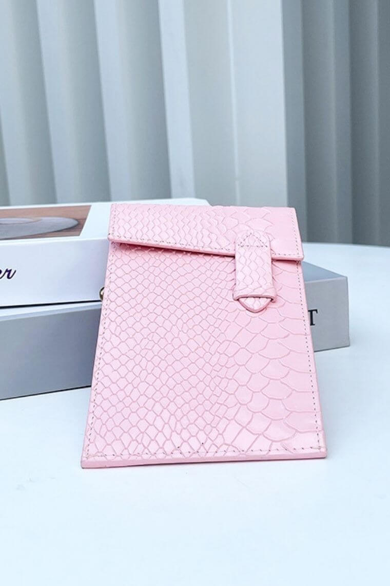 Pink snake print leather clutch purse with back zip pocket and 14 card slots