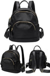Black small backpack purse in lightweight waterproof nylon with multi zip pockets and top carry handle