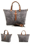 designer grey tote bag in waterproof heavy duty waxed canvas with leather handles and crossbody strap for men or women
