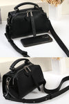 women black leather small boston bag with top carry handle and cross body strap zipper closure