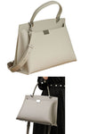women designer briefcase in cream leather with top handle and crossbody strap and 2 zip pockets for travel or work
