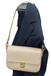 women crossbody square bag in beige leather with lock flap closure and convertible shoulder strap