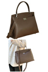 women designer briefcase in dark brown leather with top handle and crossbody strap and 2 zip pockets for travel or work