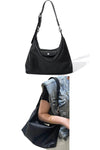 women designer black swift leather hobo bag with adjustable strap and flap closure