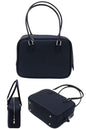 women mini retro tote bag in black leather with crossbody long strap and zipper closure in square shape 