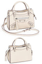 women fashion beige pebbled leather small satchel city bag with a hands-free crossbody strap and  top handles and multiple zip pockets for everyday use and fits for casual or formal occasions